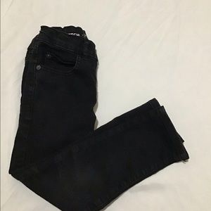 Children place black jeans